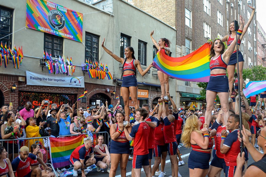 A symbol of pride: raising the rainbow flag